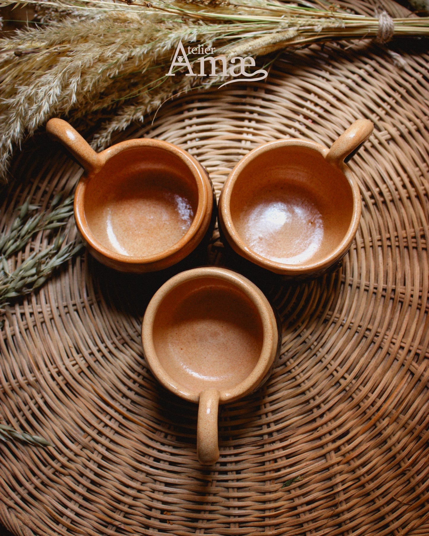 Cup inlaid with the Fehu rune and its Spiral