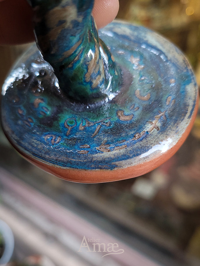 Ceramic chalice with engraved incantation