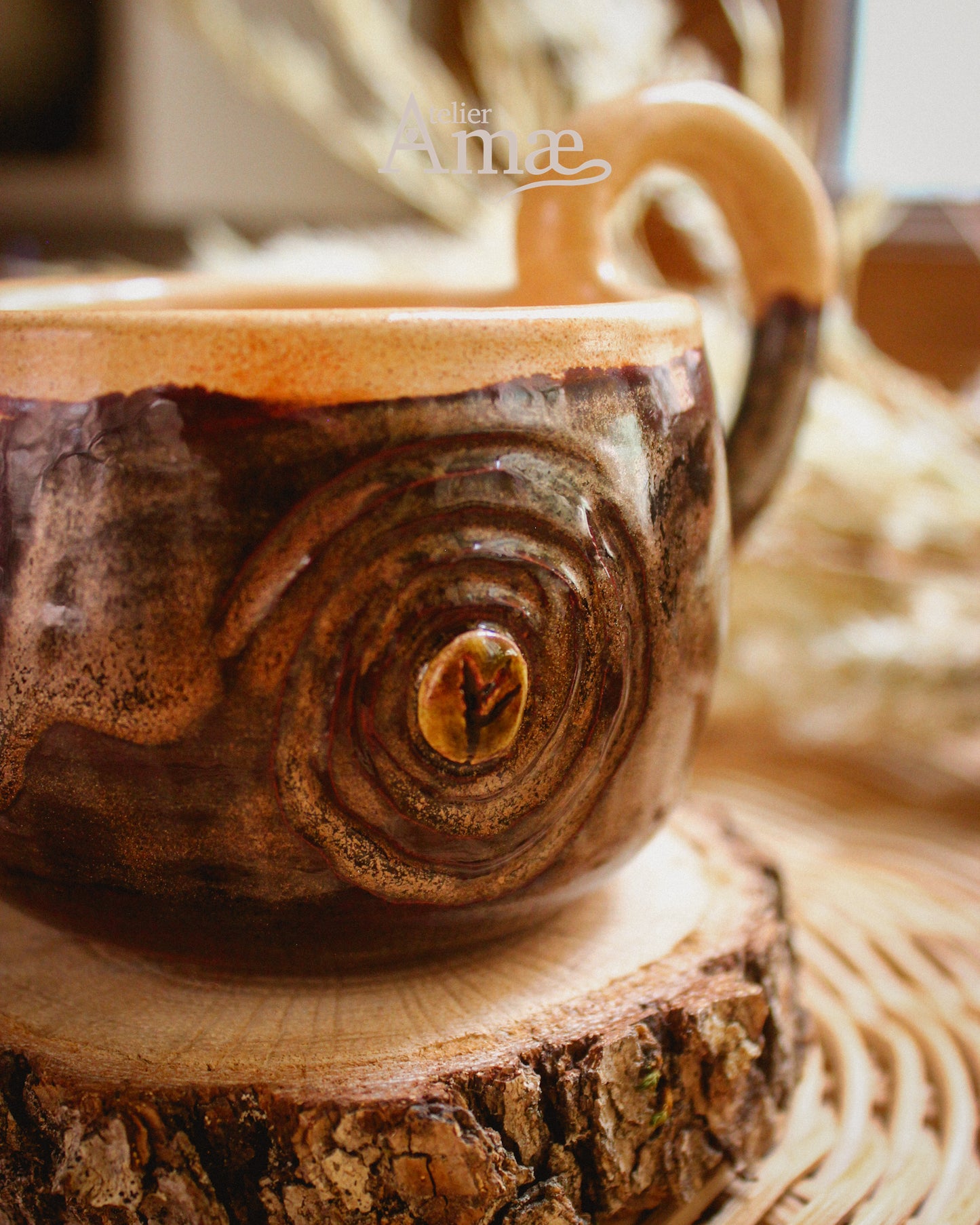 Cup inlaid with the Fehu rune and its Spiral