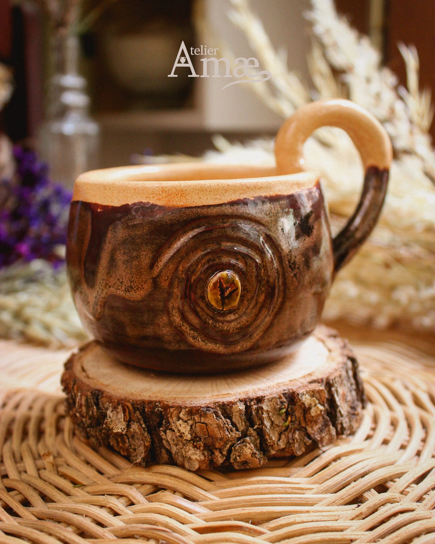 Cup inlaid with the Fehu rune and its Spiral